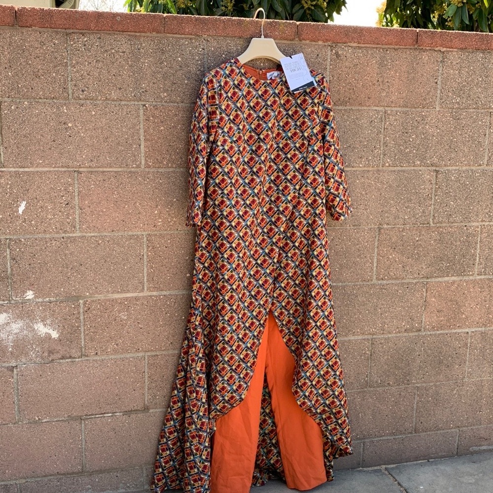 Beautiful jumpsuit in a lightweight, gorgeous color, orange in satin fabric.